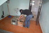 Nguyen Van Thai (SVW Executive Director) preparing crate for Sunda pangolin rescue Sunda pangolin,Sunda pangolins,pangolin,pangolins,Animalia,Chordata,Mammalia,Pholidota,Manidae,Manis,javanica,Malayan pangolin,pangolin javanais,pangolin malais,pangolín malayo,rescue,rescued,wildlif